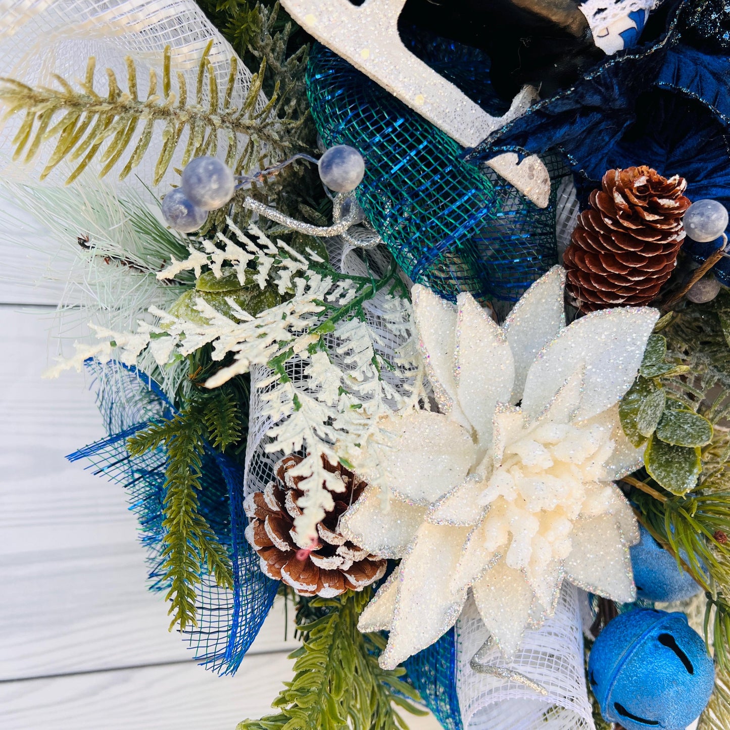 Blue bell winter front door wreath, Christmas ornament decoration, holiday porch swag, pinecone, poinsettia, ice skate, jingle sleigh bells