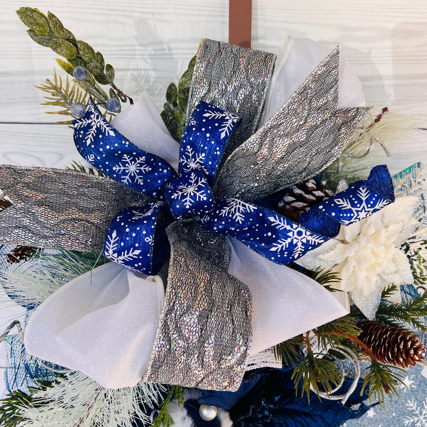 Blue bell winter front door wreath, Christmas ornament decoration, holiday porch swag, pinecone, poinsettia, ice skate, jingle sleigh bells
