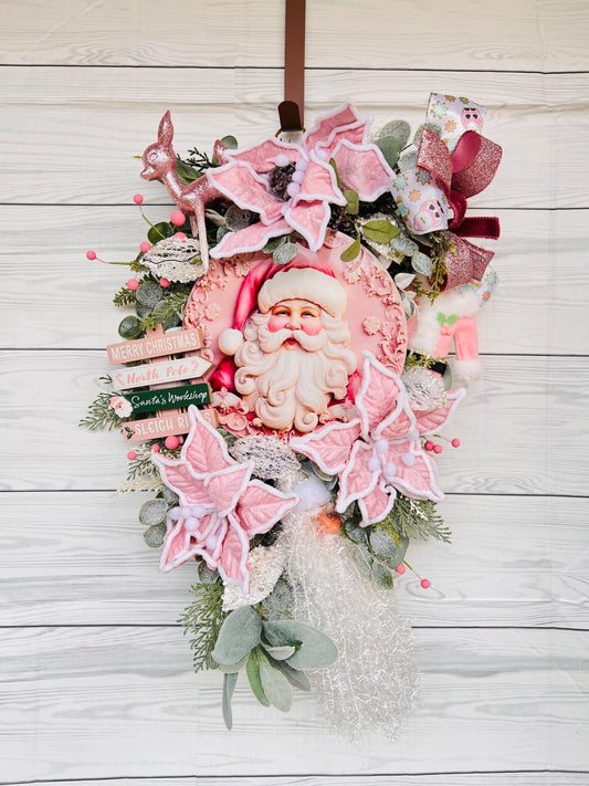 Whimsical Pink Santa Christmas Wreath with Vintage Rudolph, Non-Traditional Pink Holiday Decor with Poinsettias, Glitter winter bow