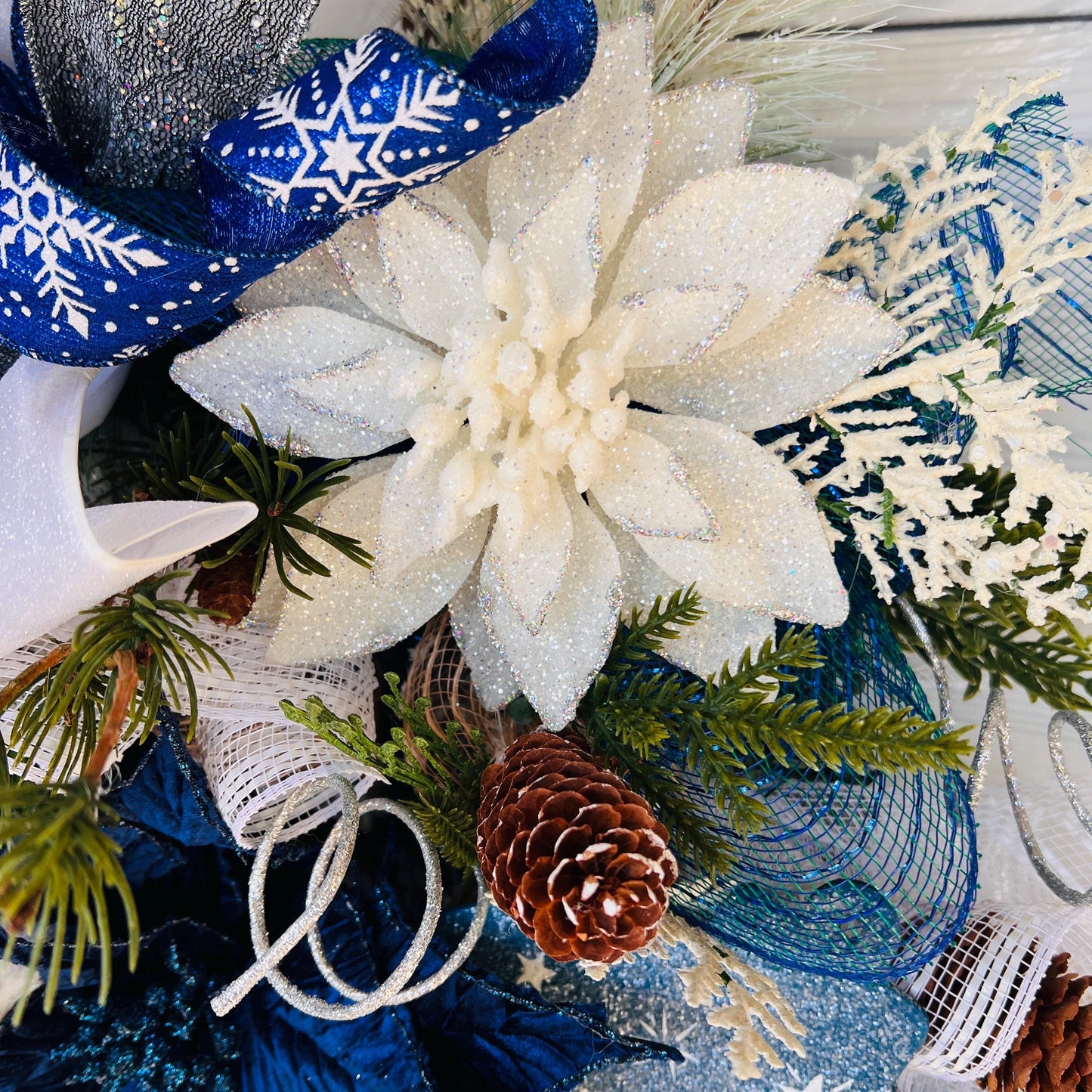 Blue bell winter front door wreath, Christmas ornament decoration, holiday porch swag, pinecone, poinsettia, ice skate, jingle sleigh bells